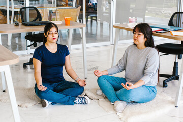 Wall Mural - latin business people meditating and doing yoga in office in Mexico city