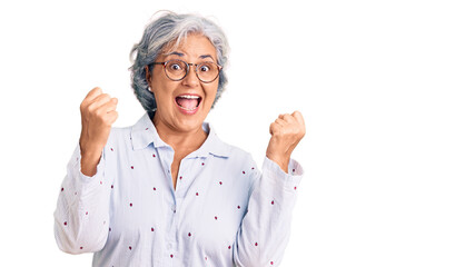 Poster - Senior woman with gray hair wearing casual business clothes and glasses screaming proud, celebrating victory and success very excited with raised arms