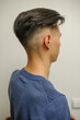 © Oksy001 - Short haircut on a young man with dark hair