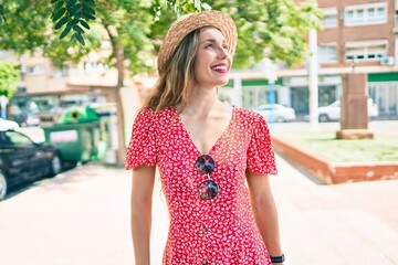 Sticker - Young blonde woman on vacation smiling happy walking at street of city