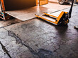 © Weerayuth - Worker driving forklift loading shipment carton boxes goods on wooden pallet at loading dock from container truck to warehouse cargo storage in freight logistics, transportation industrial, delivery