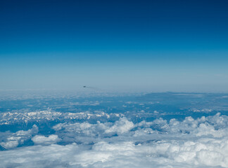 Wall Mural - white heavy clouds in the blue sky. panoramic cloudscape above the clouds.