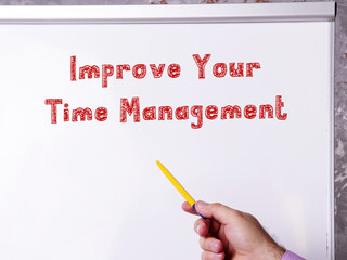 Motivational concept about Improve Your Time Management with sign on the piece of paper.