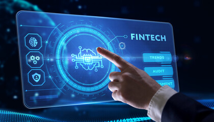 Fintech -financial technology concept.Young businessman  select the icon Fintech on the virtual display.