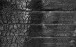 Charred wooden wall texture with space black background. The horizontal position of the boards.