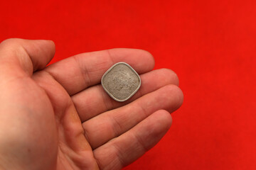 Vintage indian coin two annas in hand