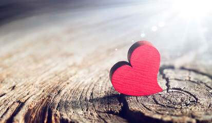 Wall Mural - Wooden Heart With Sunlight And Flare Effect In Defocused Background - Valentines Day 