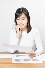 Woman viewing materials at a meeting