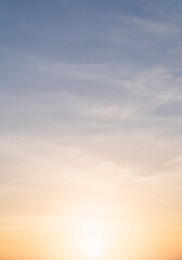 Wall Mural - sunset sky vertical in the morning with orange sunrise on clouds fluffy