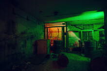 Old Broken Dirty Abandoned Industrial Building Basement, Illuminated By Color Lamp