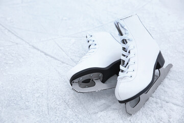 Wall Mural - Pair of figure skates on ice. Winter outdoors activities