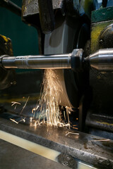 Wall Mural - External grinding of a cylindrical shaft on a cylindrical grinding machine.