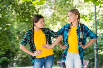 Wall Mural - Little children with vogue look pose in casual fashion style summer outdoors, fashionistas