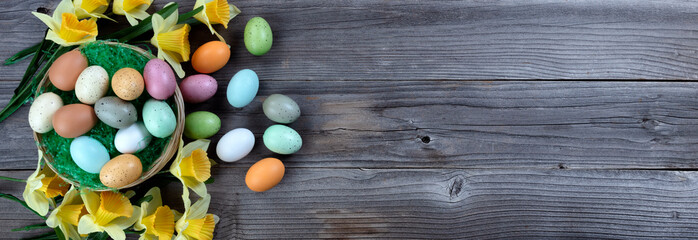 Sticker - Happy Easter holiday season with basket of eggs plus grass and daffodil flowers blossoms on rustic wooden planks