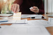 © skarie - UX or UI designers designing on digital tablet and smartphone application layout prototype project.