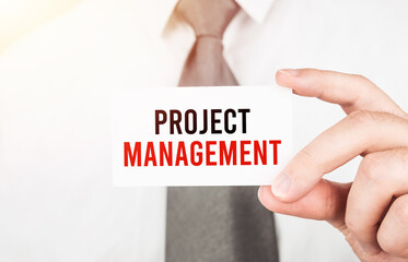 Poster - businessman holding a card with text project management,business concept
