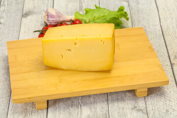 Wall Mural - Hard yellow tasty cheese brick