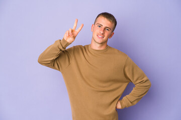 Young caucasian handsome man showing number two with fingers.