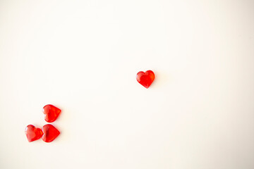 small red hearts on white background