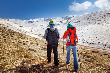 Wall Mural - Happy Couple Walking in the Mountains