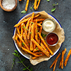 Sweet potato fries with mayo and ketchup, homemade roasted in the oven