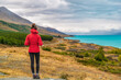 © Maridav - New Zealand travel - Tourist hiker on Road Trip looking at nature view of Lake Pukaki by Aoraki aka Mount Cook at Peters lookout, a famous travel tourist destination.