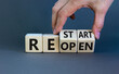 © Dzmitry - Reopen and restart symbol. Businessman hand turns cubes and changes the word 'reopen' to 'restart'. Beautiful grey background. Business and reopen - restart concept. Copy space.