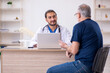 © Elnur - Old male patient visiting young male doctor