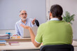 © Elnur - Old male teacher and young male student in the classroom