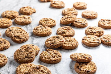 freshly baked Chocolate chip cookies on a marble countertop. Copy space.