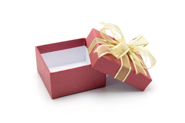 Canvas Print - Red gift box and ribbon open isolated on white background, presents in valentine day or Christmas day, object in birthday or anniversary, package with wrap luxury, nobody, holiday and festive concept.