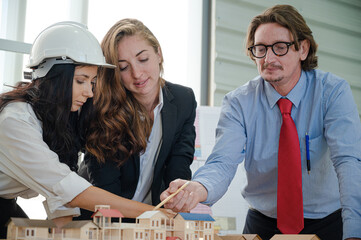 Group of caucasian architect people meeting and working together at the office.