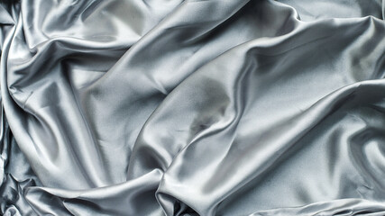 Grey silk or satin fabric background