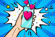 Sending love message in pop art style. Hand holding phone with love heart on screen.
