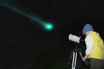 Wall Mural - a child is watching a comet through a telescope.