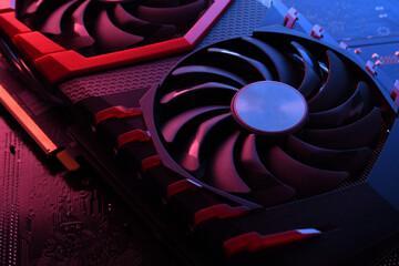 Poster - Computer game graphics card, videocard with two coolers on circuit board ,motherboard background. Close-up. With red-blue lighting