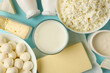 Different fresh dairy products on blue background, top view