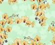 Seamless background with orchids. Yellow flowers on green vector pattern.