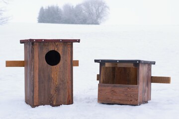 Two new woden bird houses, for owl and common kestrel nesting, ready for setting. Ornithology and nature protection concept