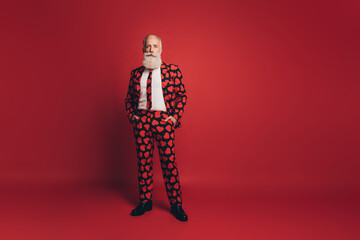 Sticker - Photo of self-assured handsome bearded gentleman hands pockets wear heart print tux tie isolated red background