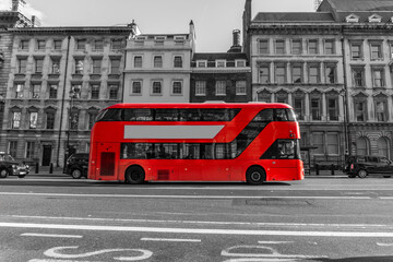 Sticker - RED Double Decker Bus driving down city street - Red Color in Black and White.