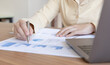 © Puwasit Inyavileart - Financial businesswomen analyze the graph of the company's performance to create profits and growth, Market research reports and income statistics, Financial and Accounting concept.
