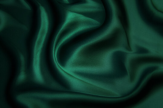 Wall Mural -  - Texture, background, pattern. Texture of green silk fabric. Beautiful emerald green soft silk fabric.