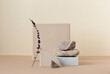Minimalist monochrome still life composition with natural nature materials: stone, marble, earthy clay and plant dry branch in beige color, copy space, abstract modern art design concept