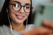© Drobot Dean - Happy young woman listening music with earphones and mobile phone