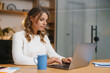 © Drobot Dean - Successful young businesswoman working in office