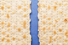 Broken Jewish Flatbread Matza For Passover On Color Background, Closeup