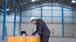© witthaya - manager using laptop check and control for warehouse logistics
