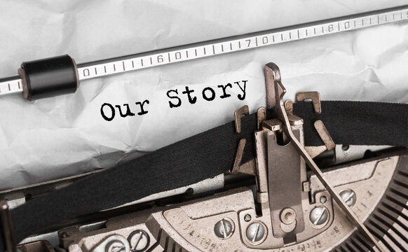 Text Our Story typed on retro typewriter