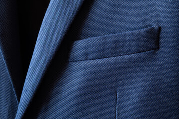 high resolution with details and quality shot of formal dark blue wool suit fabric texture. with fro